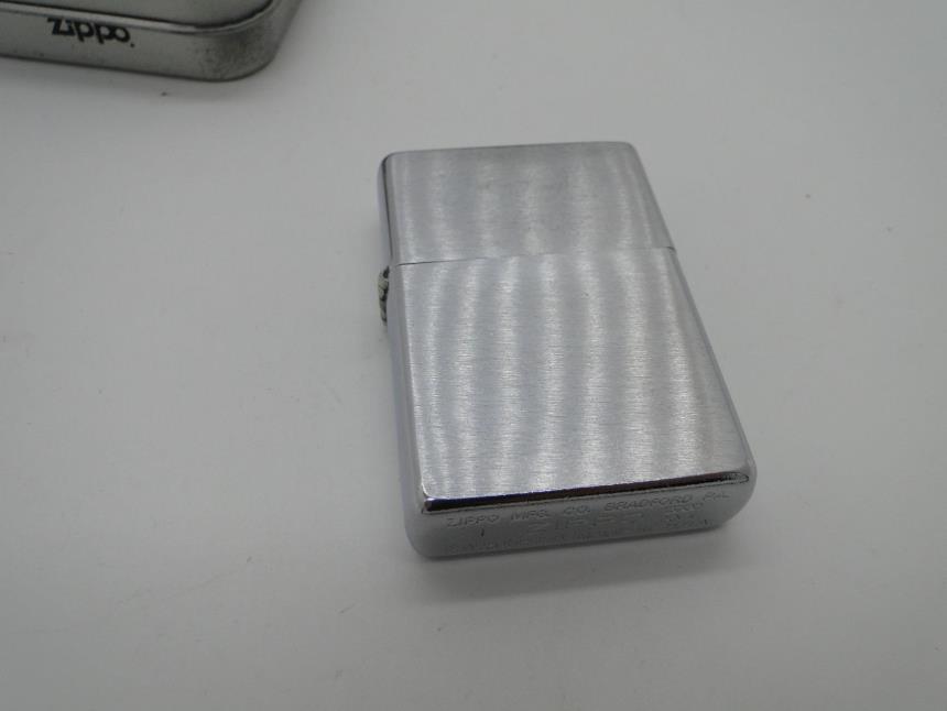 MECHERO CON CAJA AÑO 2000