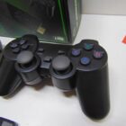 VIDECONSOLA CON 2 MANDOS Y CAJA