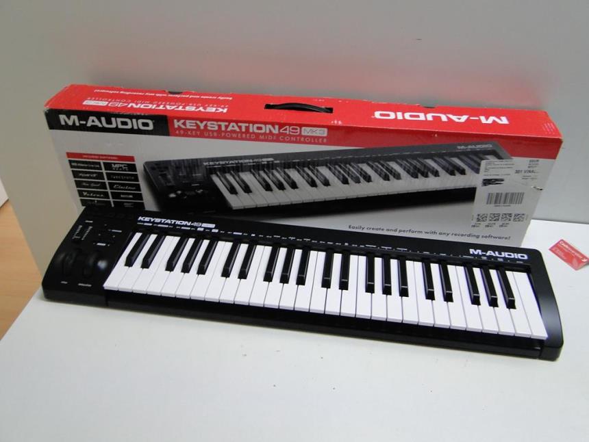 articulos_imagen1_175963.jpg TECLADO MIDI 49 TECLAS CON CAJA