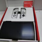 NINTENDO SWITCH OLED CON CAJA Y JUEGO 51 GAMES