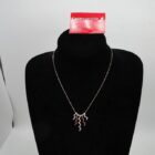 CADENA DE ORO DE 18 K CON COLGANTES