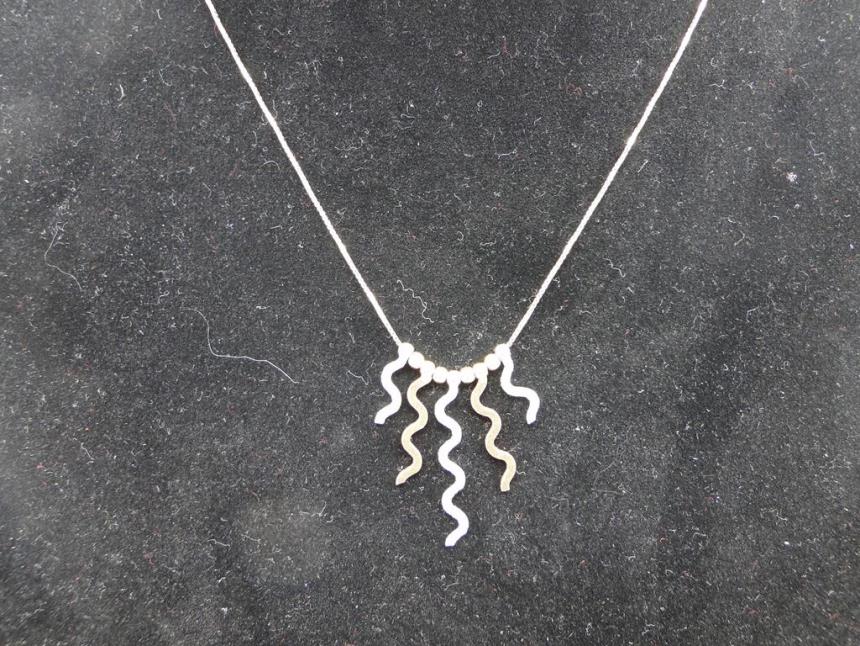 CADENA DE ORO DE 18 K CON COLGANTES